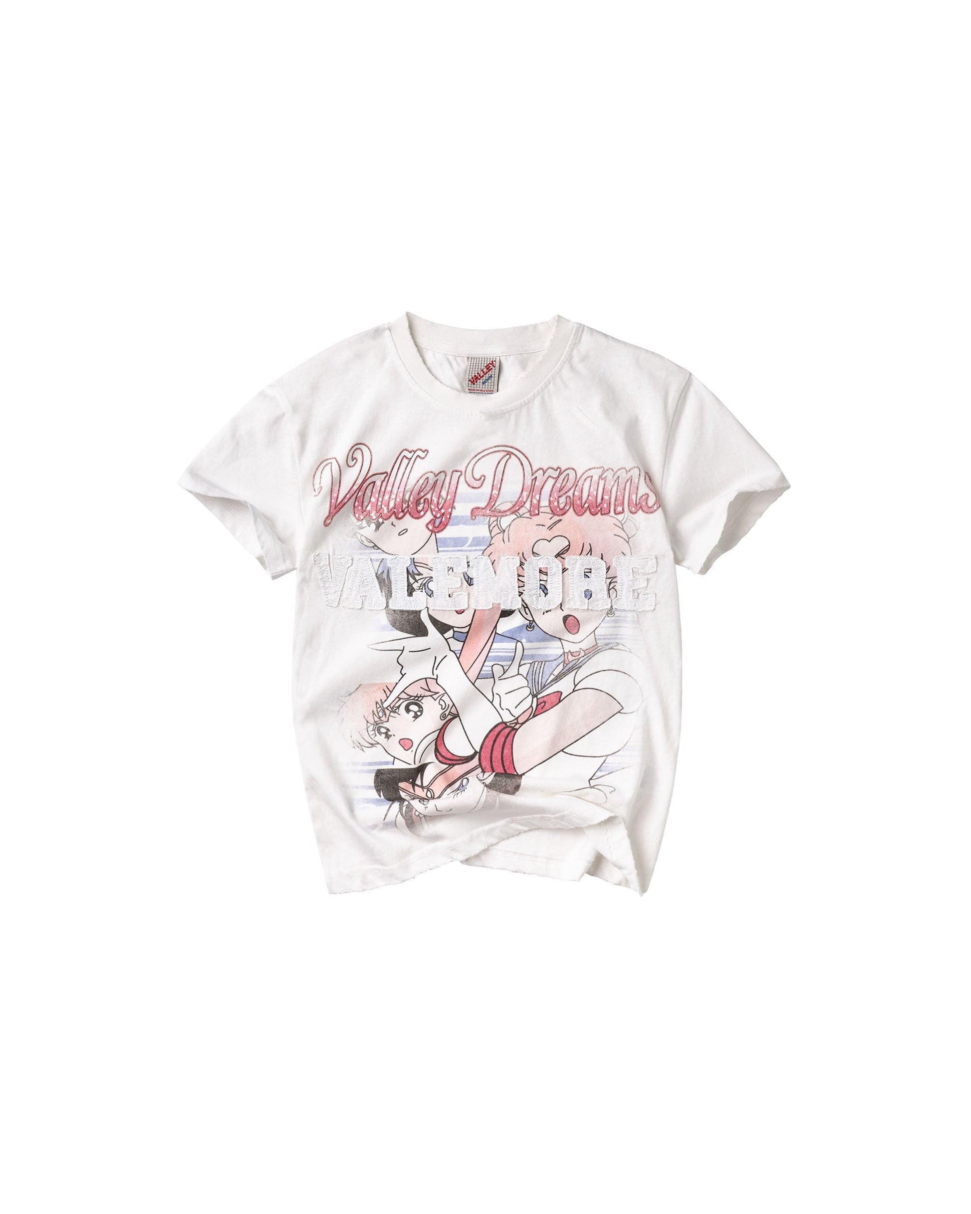 A white short-sleeve graphic t-shirt featuring a manga-style illustration of Sailor Moon and the text 'Valley Dreamers' in pink script across the chest.