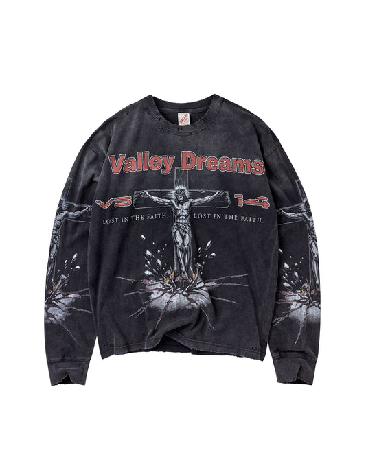 A washed black long-sleeve graphic sweatshirt featuring a crucifix design and the text 'Valley Dreams' across the chest, displayed flat against a white background.